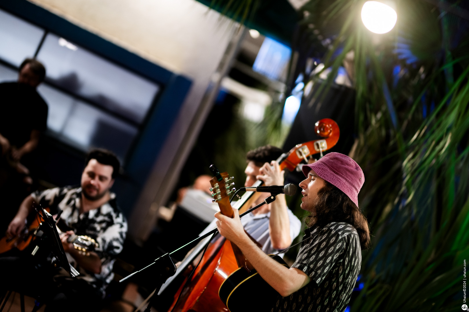 Live band performs at indoor event with audience