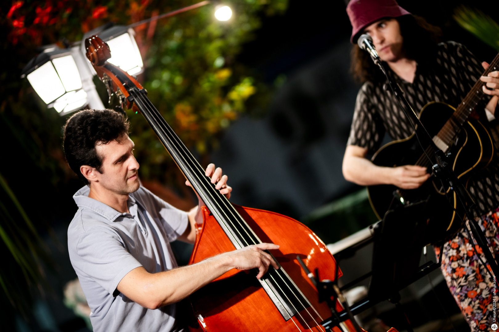 Two musicians playing double bass and guitar outdoor