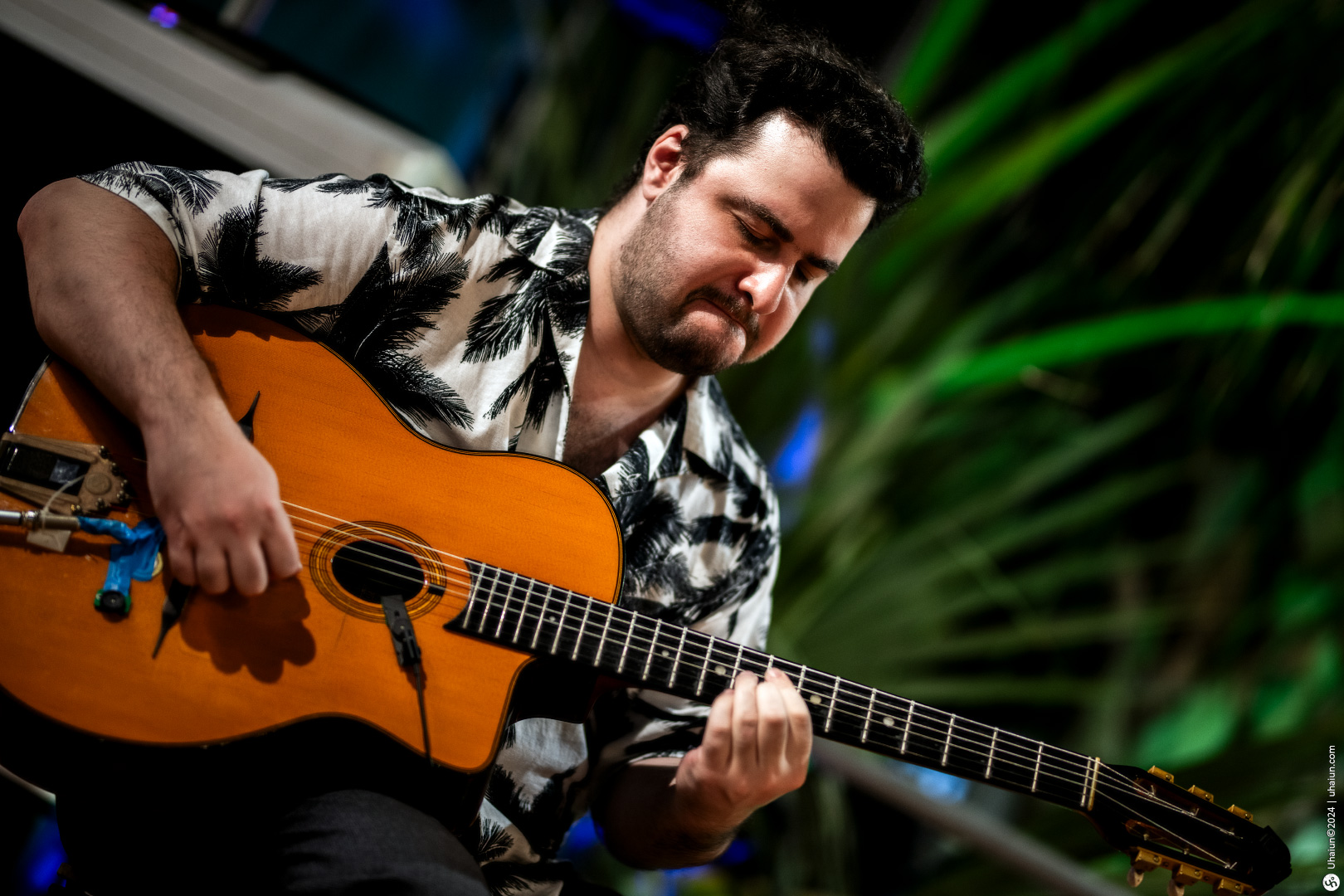 Man playing guitar at a live music event