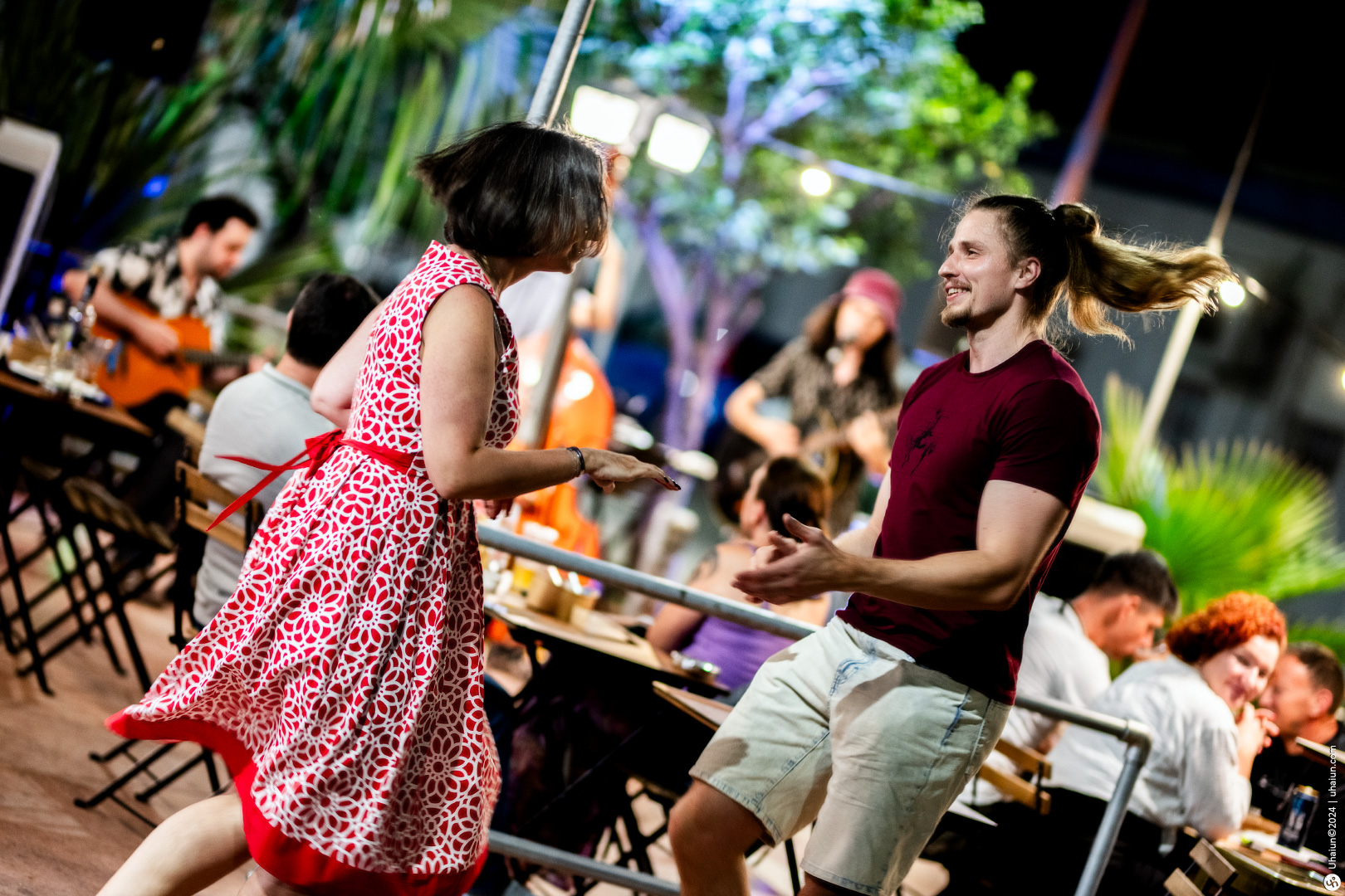 Couple dancing at an outdoor evening event