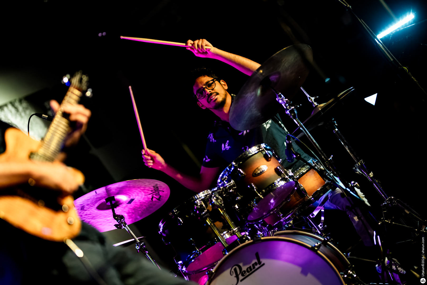 Drummer performing live on stage