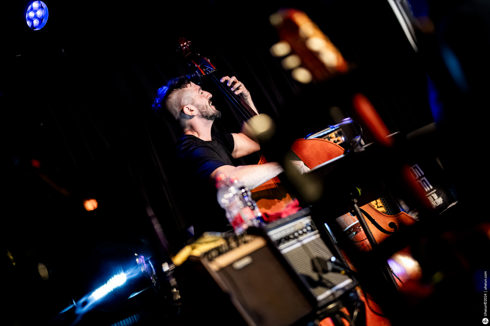 Man playing double bass at a concert stage