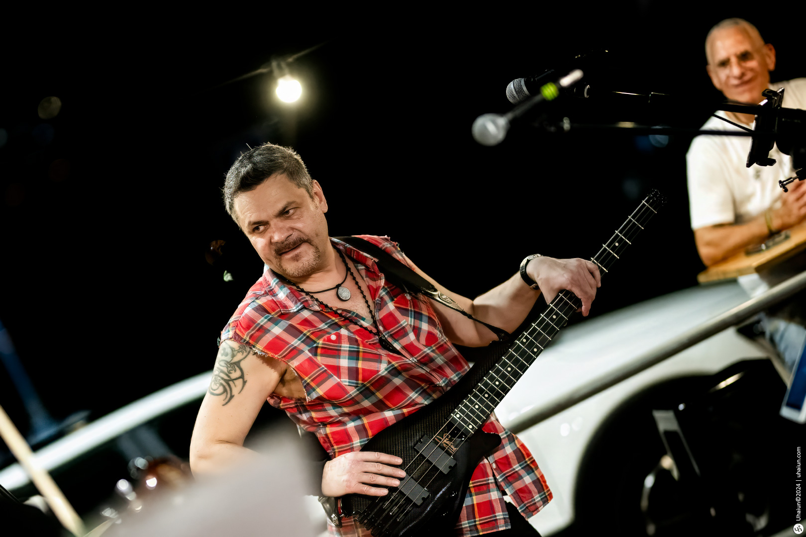 Bass guitarist performing live on stage