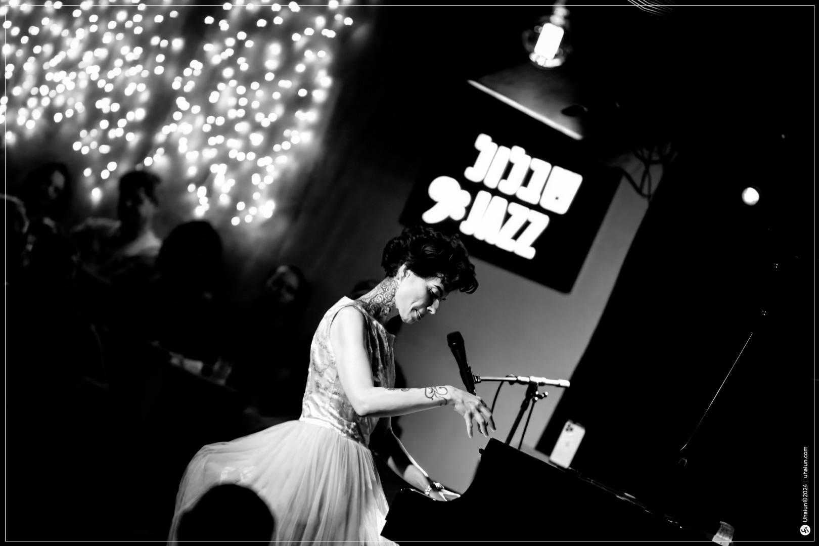 Kama Kamila playing piano at a jazz concert