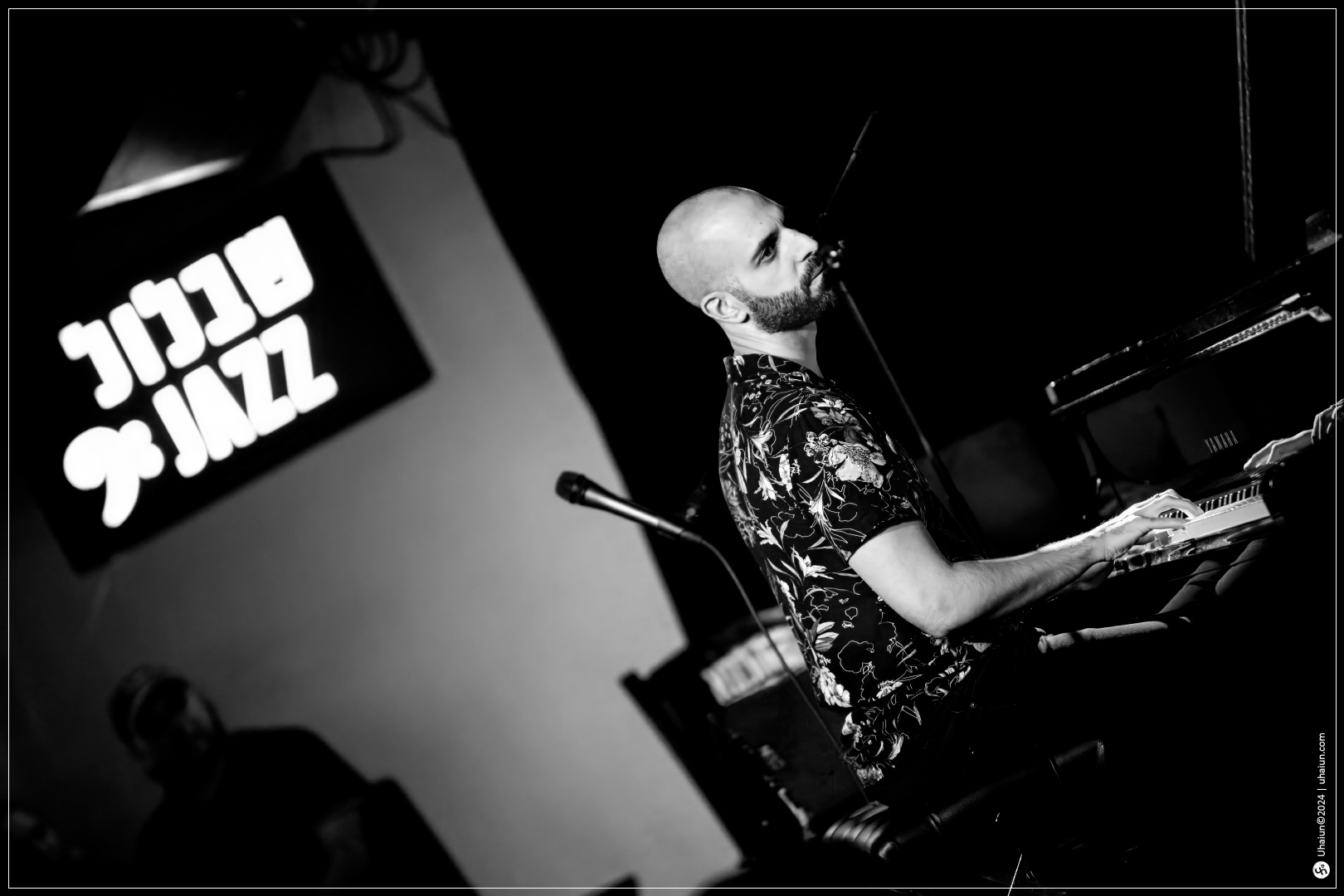 Musician playing piano at jazz club event