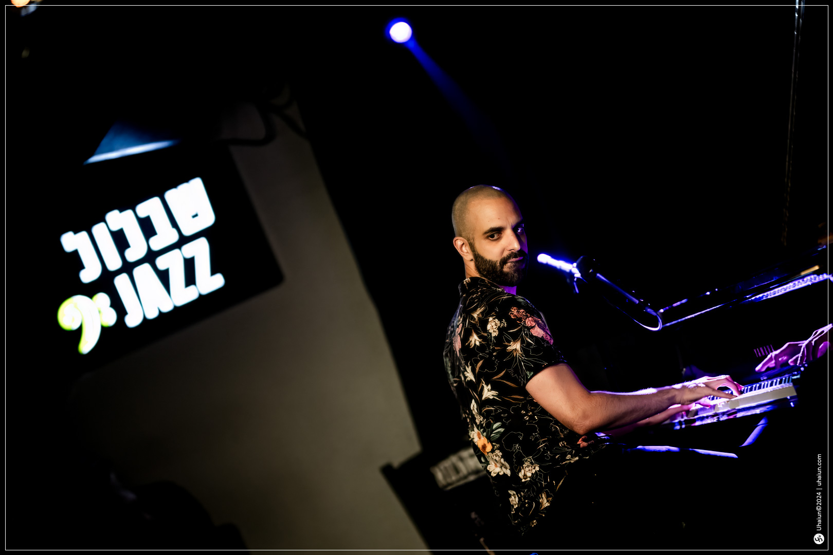 Musician playing keyboard at a live jazz concert