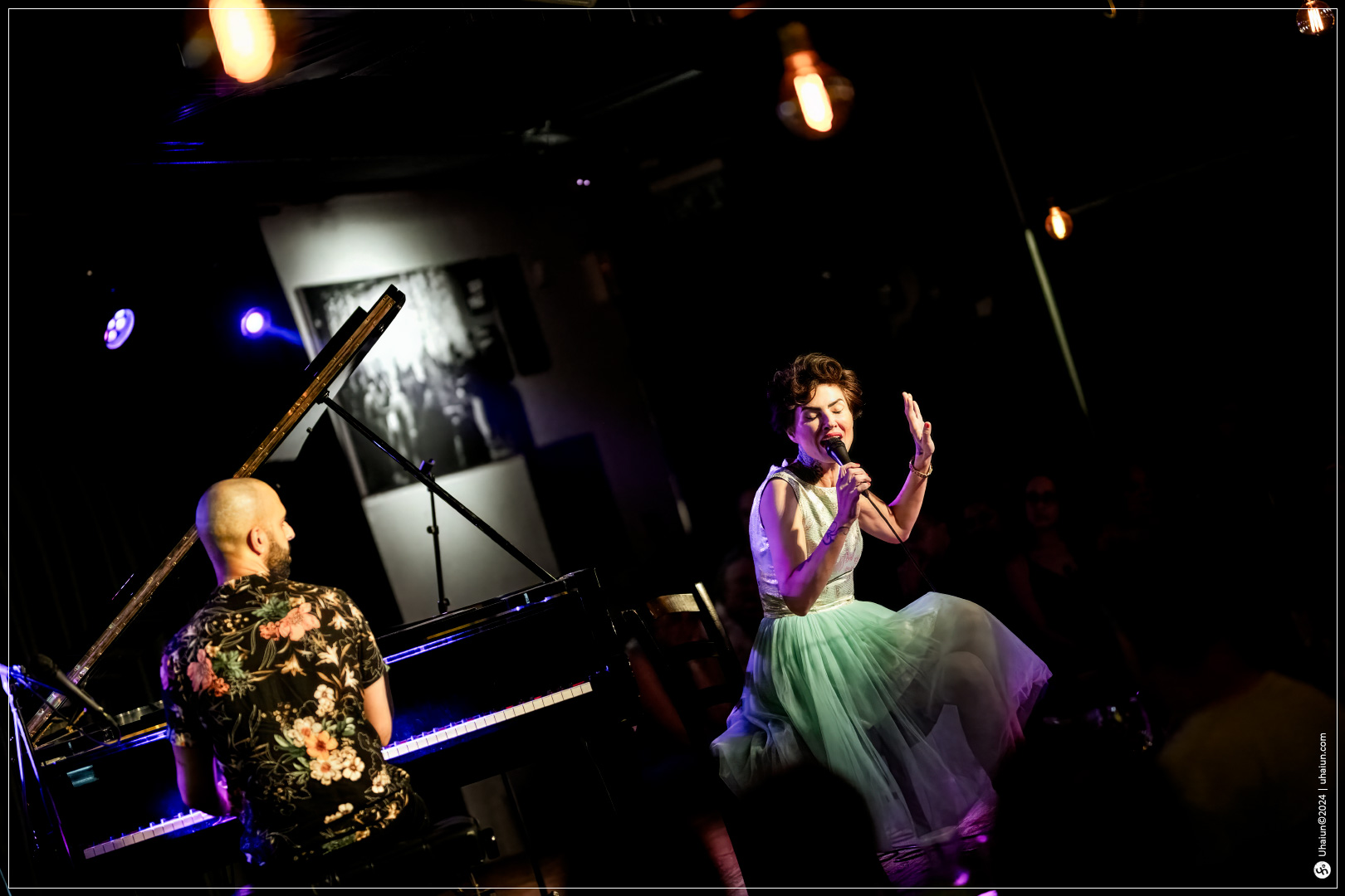 Kama Kamila performing live on stage with pianist