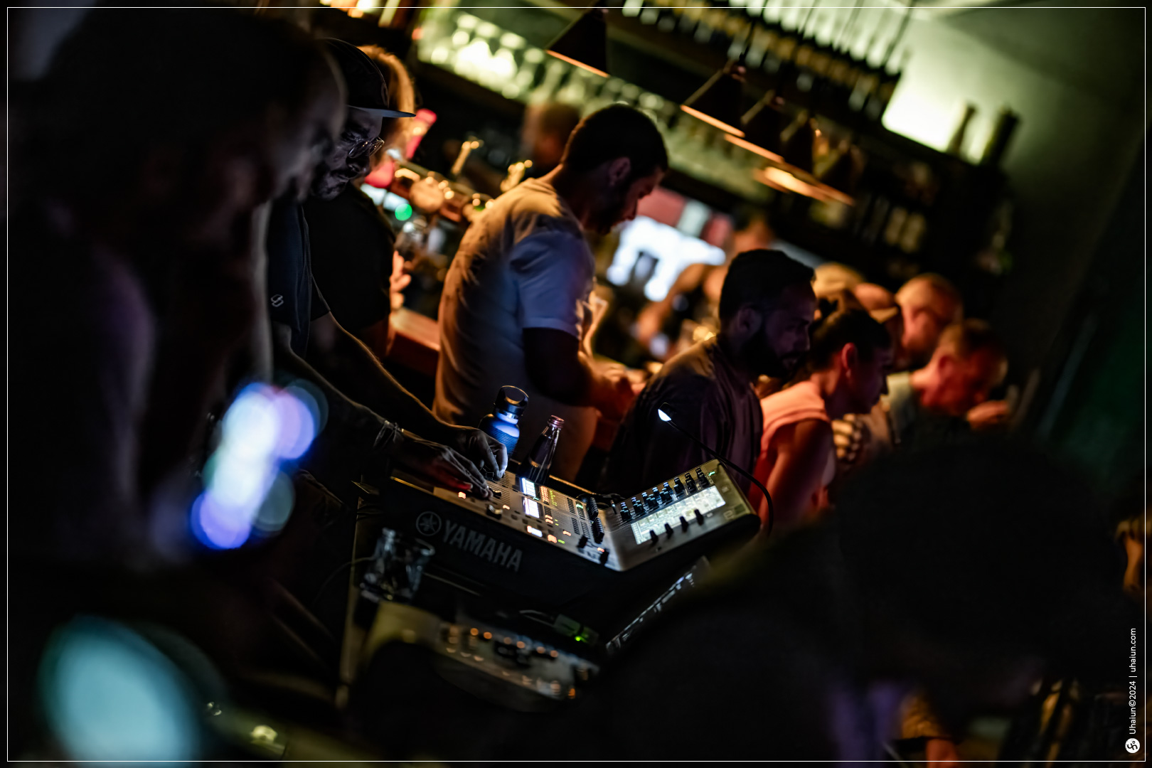DJ performing at crowded nightlife venue