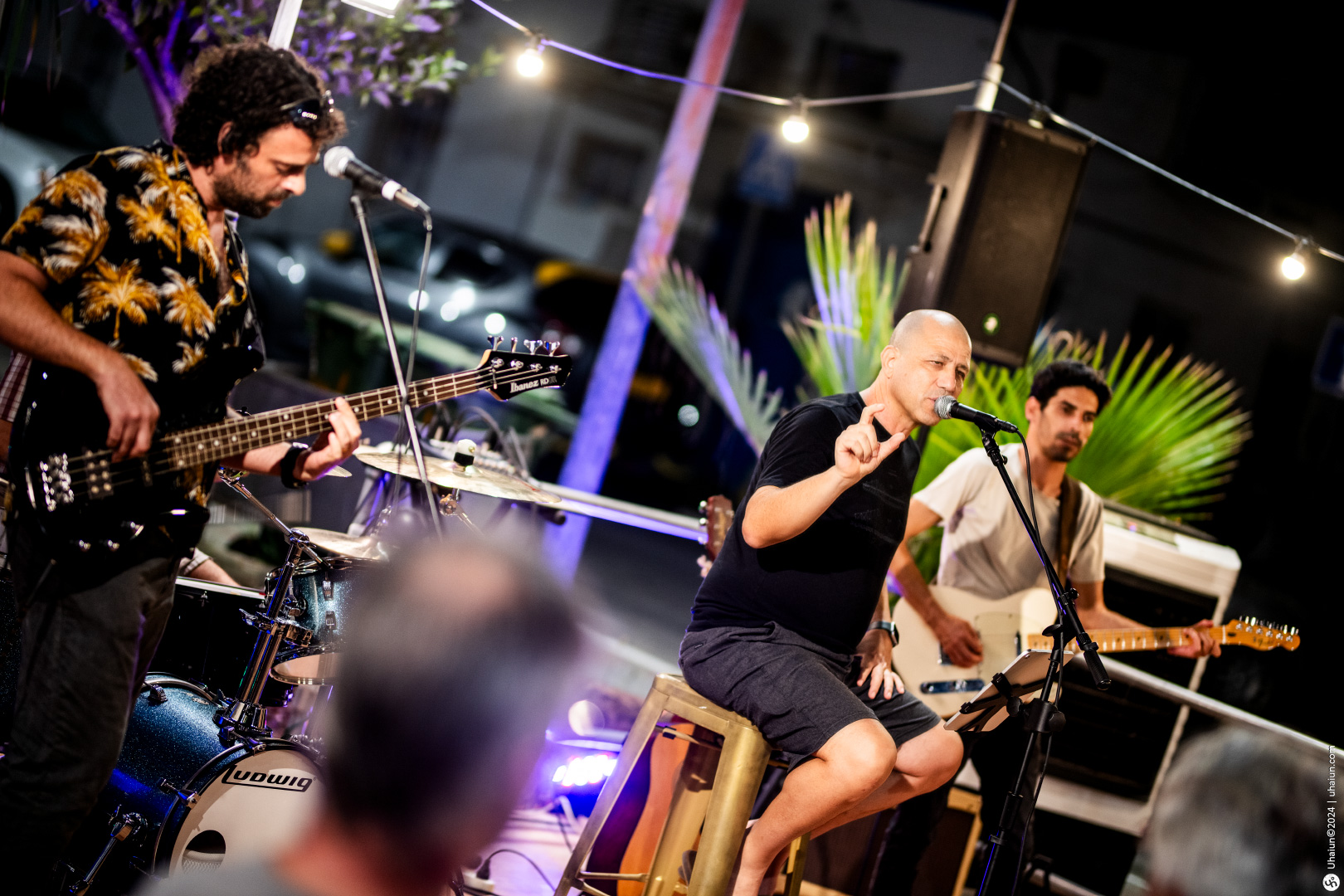 Live band performing at an outdoor evening event