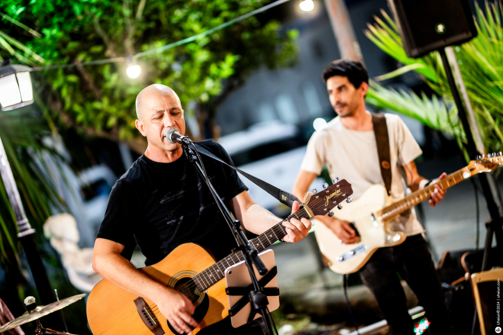 Live band performing at an outdoor evening event