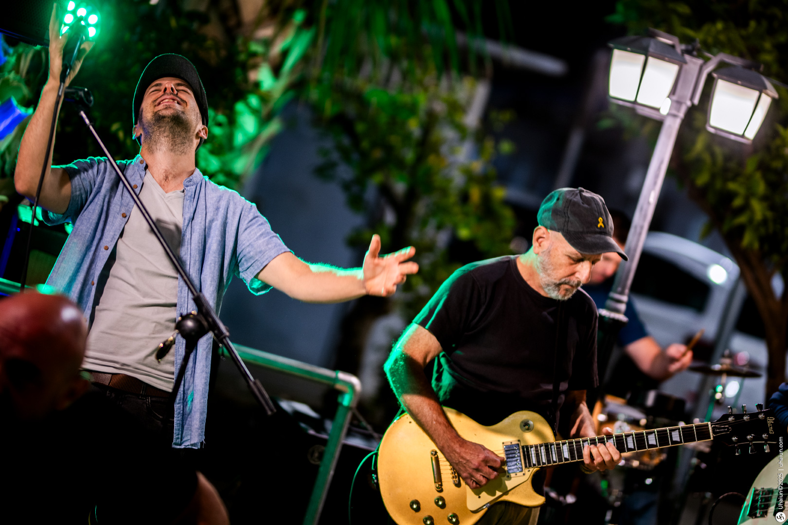 Live outdoor concert with energetic guitar performance