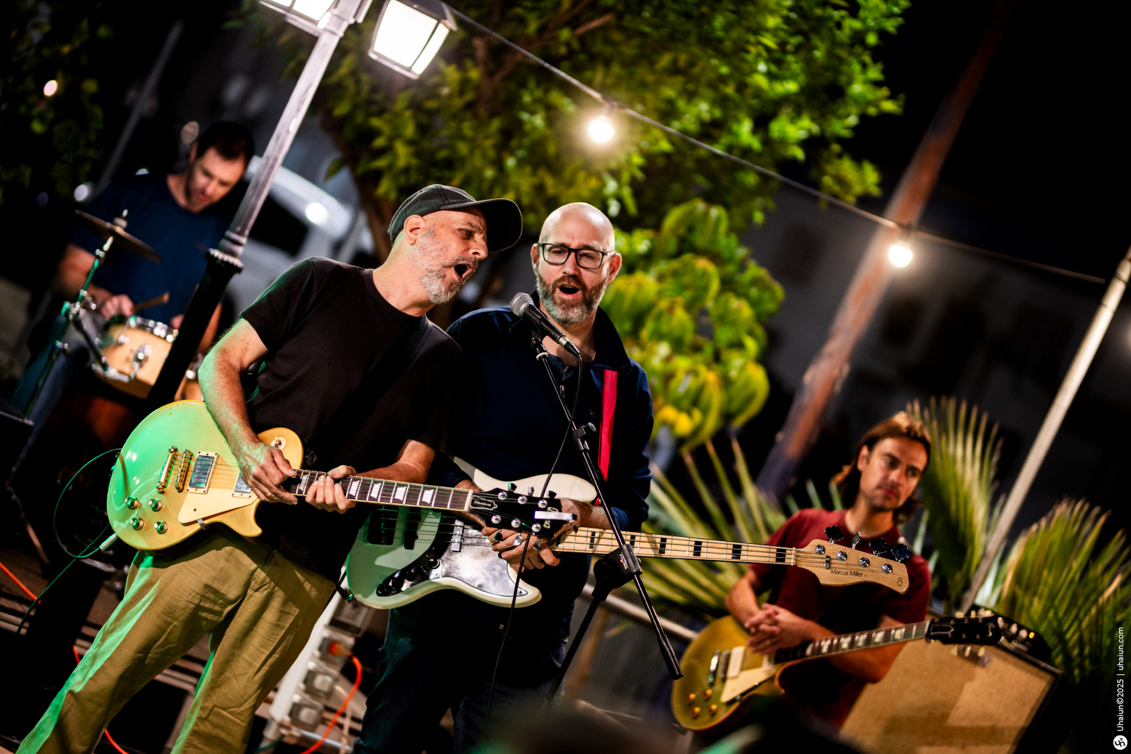 Band performing live outdoors at night event