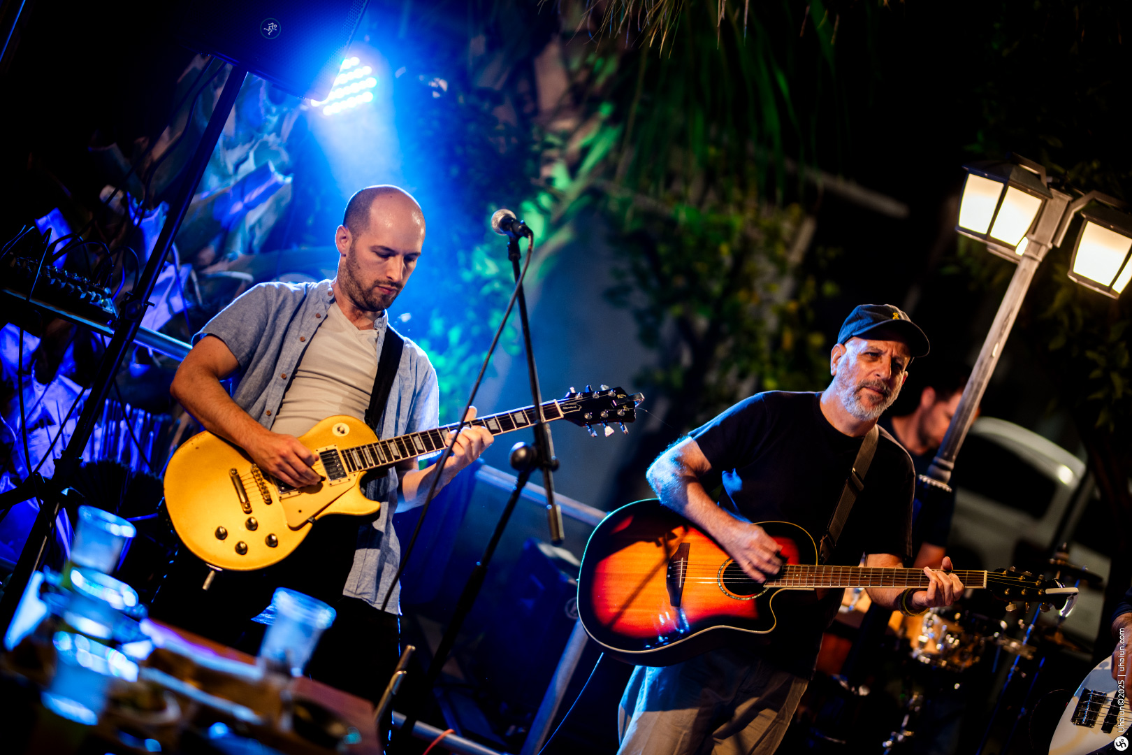 Musicians performing live at outdoor night venue