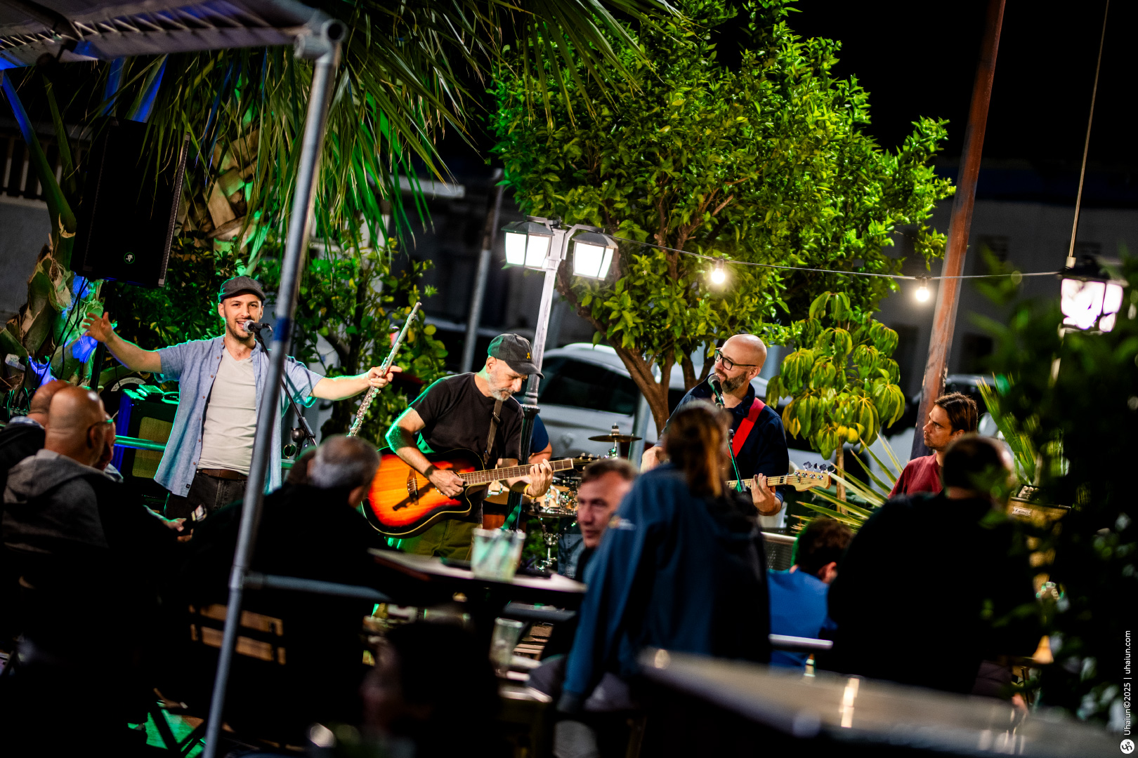 Live band performing in vibrant outdoor setting