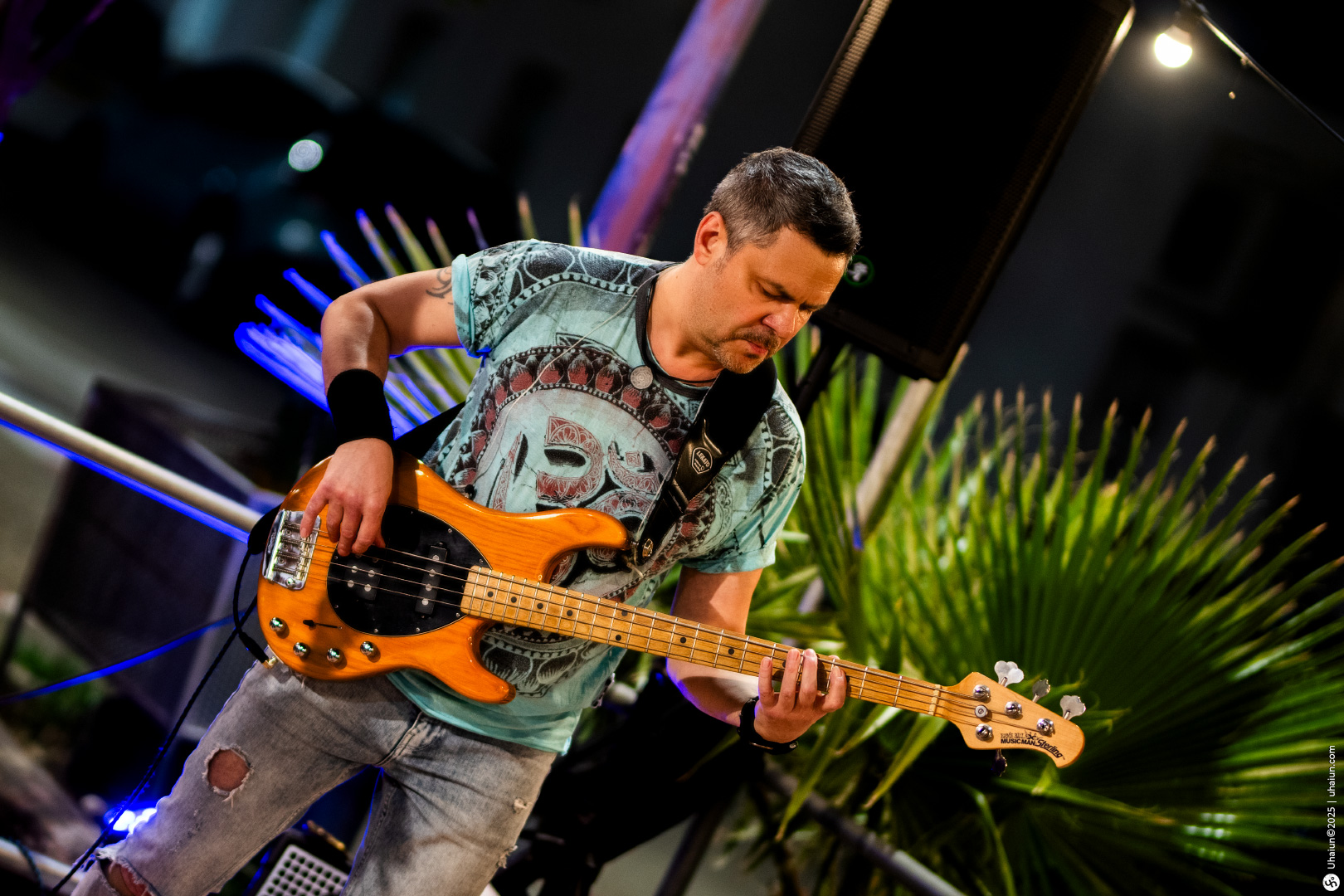 Man performing live music with electric bass