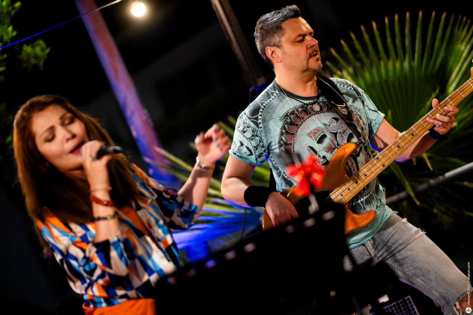 Musicians performing live outdoor evening concert