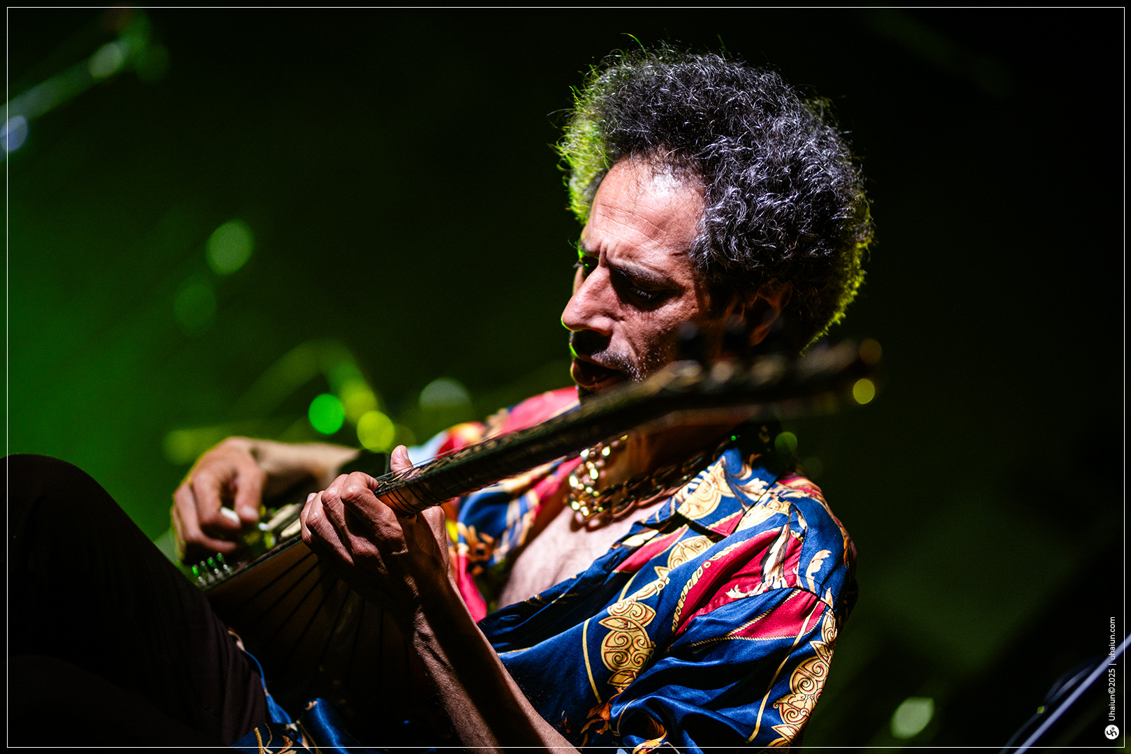 Musician intensely playing on stage performance