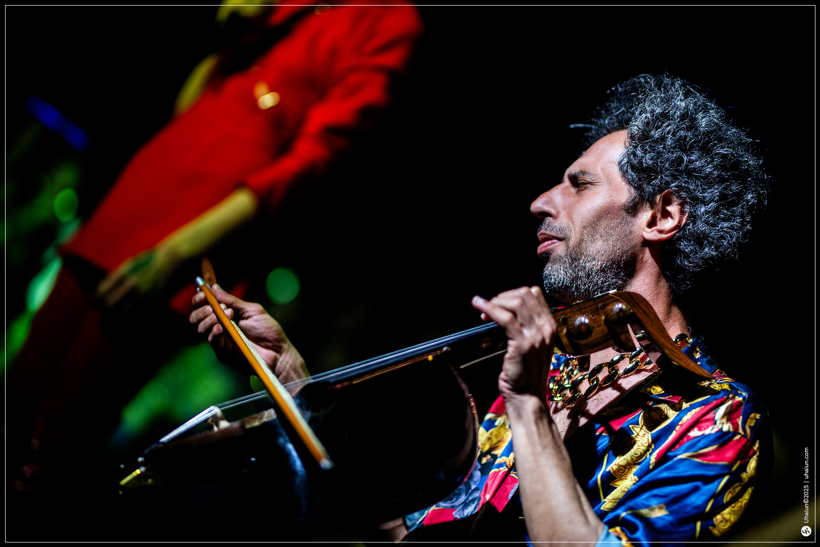 Musician passionately playing on stage performance