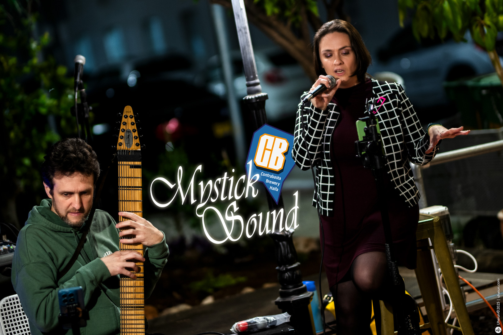 Musician duo performing live at outdoor venue
