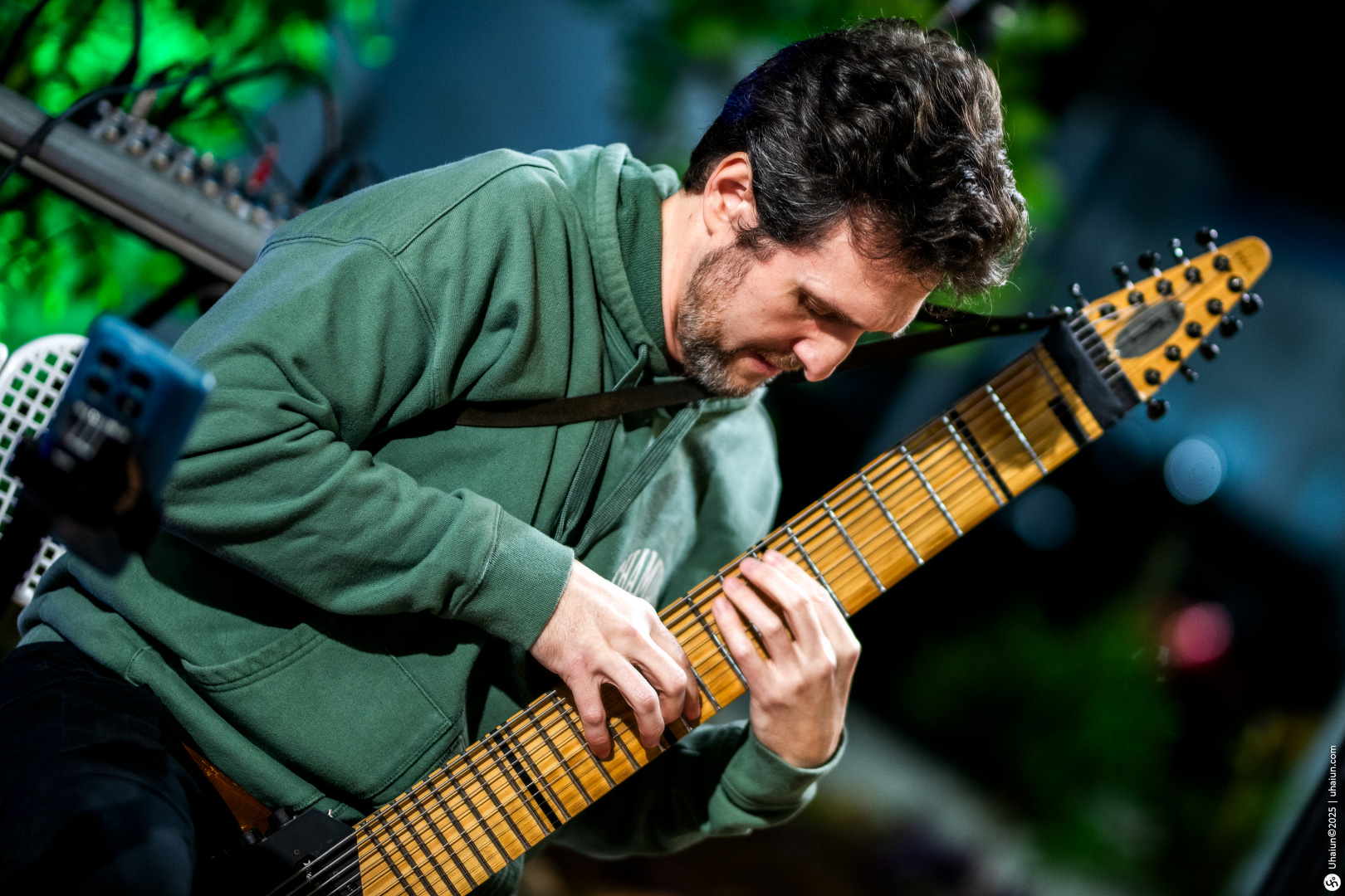 Musician playing a unique multi-string instrument live