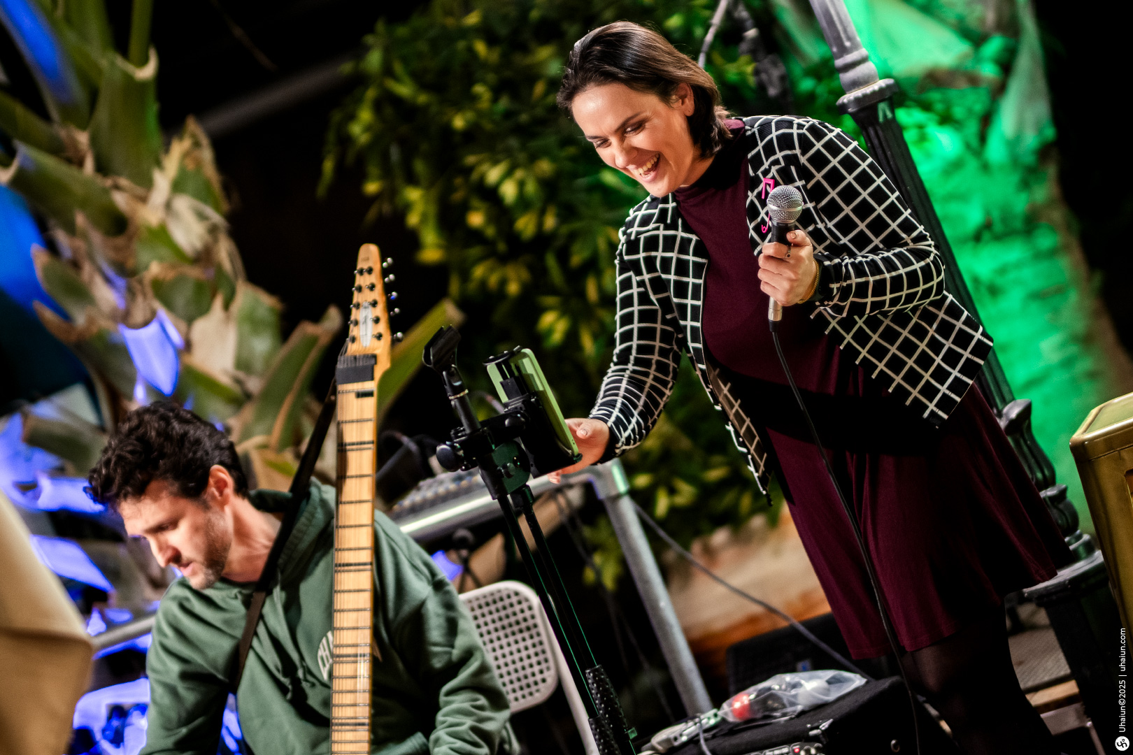 Musicians setting up equipment at outdoor event