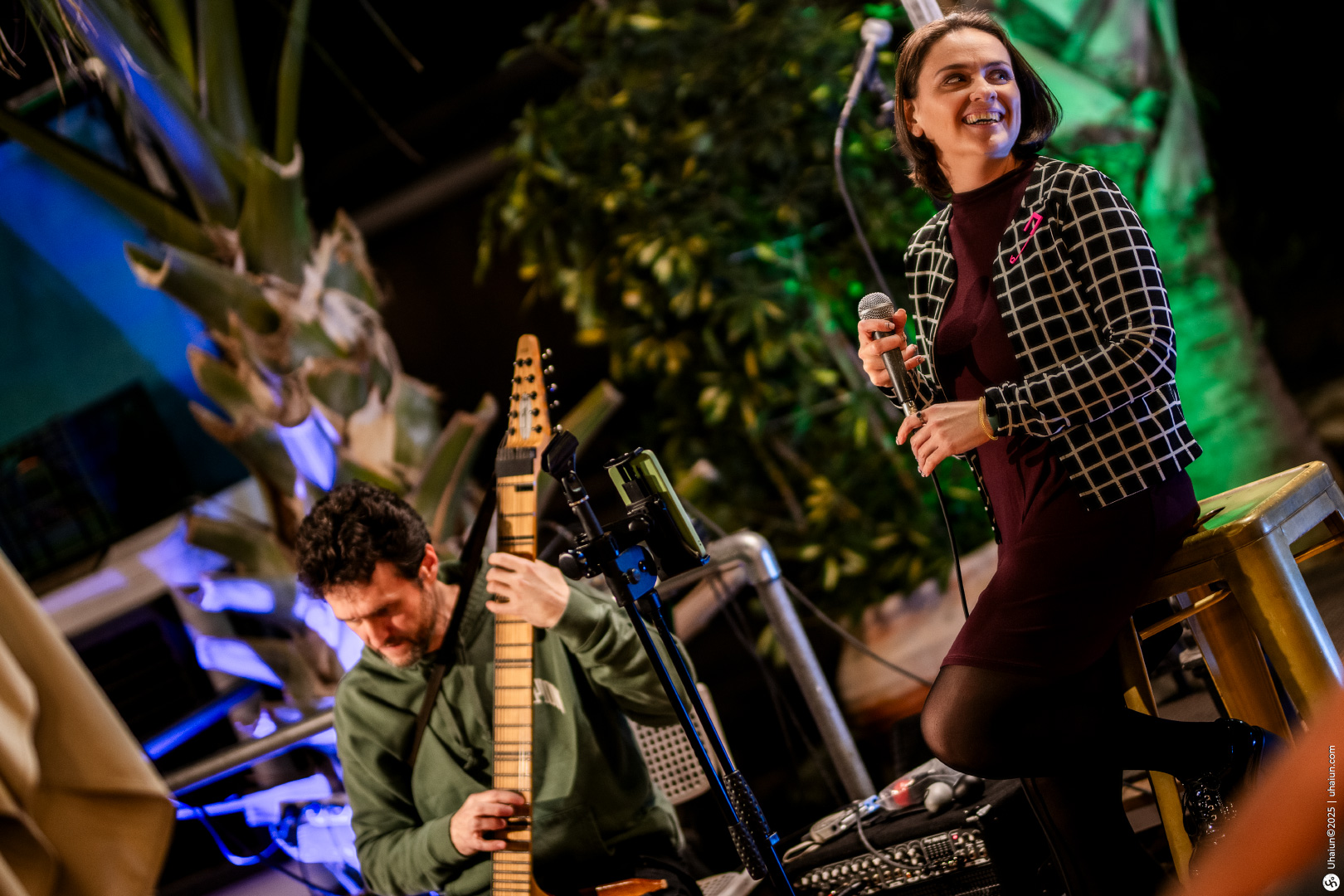 Musicians performing at an outdoor night event