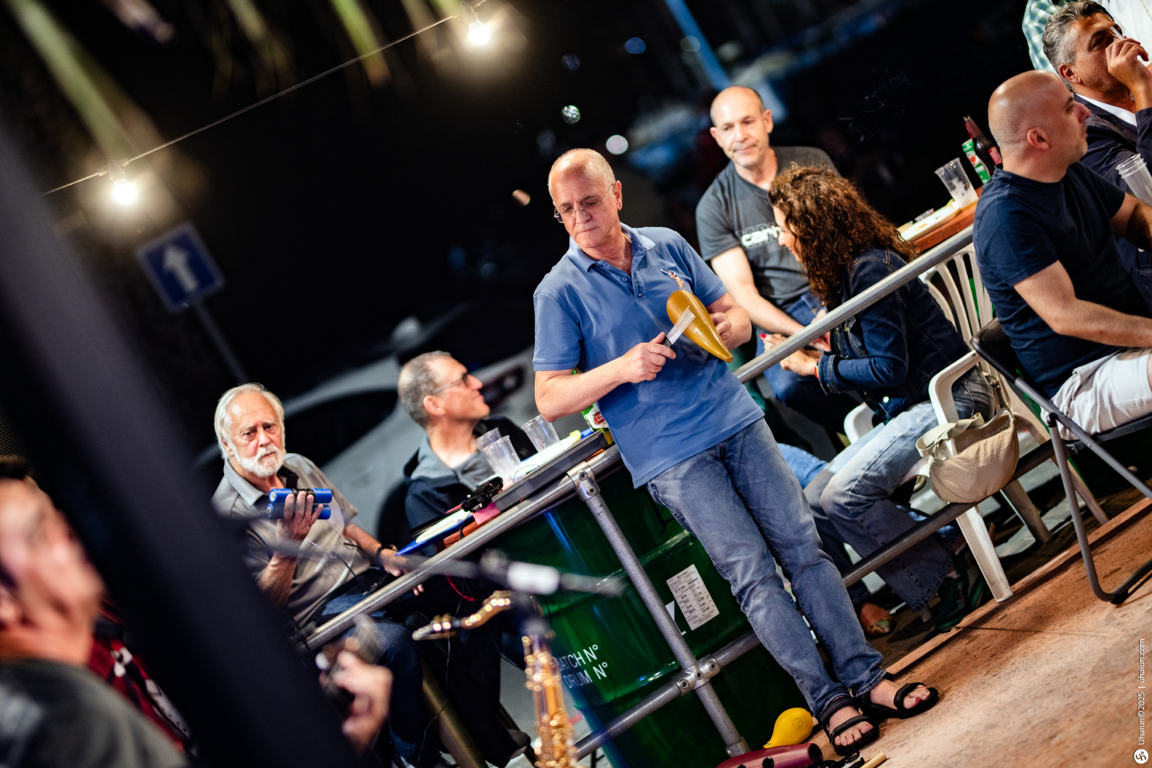 Group of people enjoying outdoor musical performance