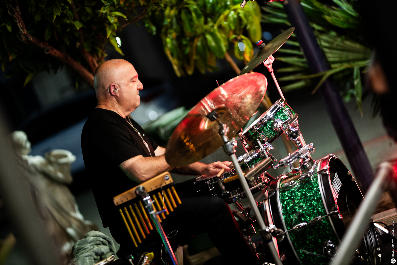 Man playing drums in an outdoor concert