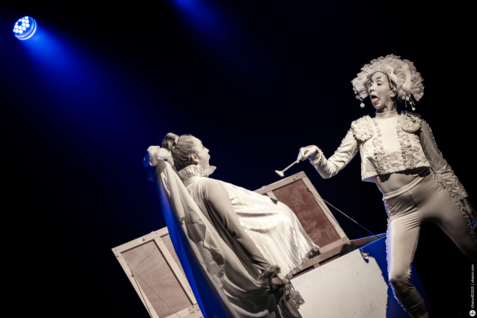Two performers on stage during theatrical act