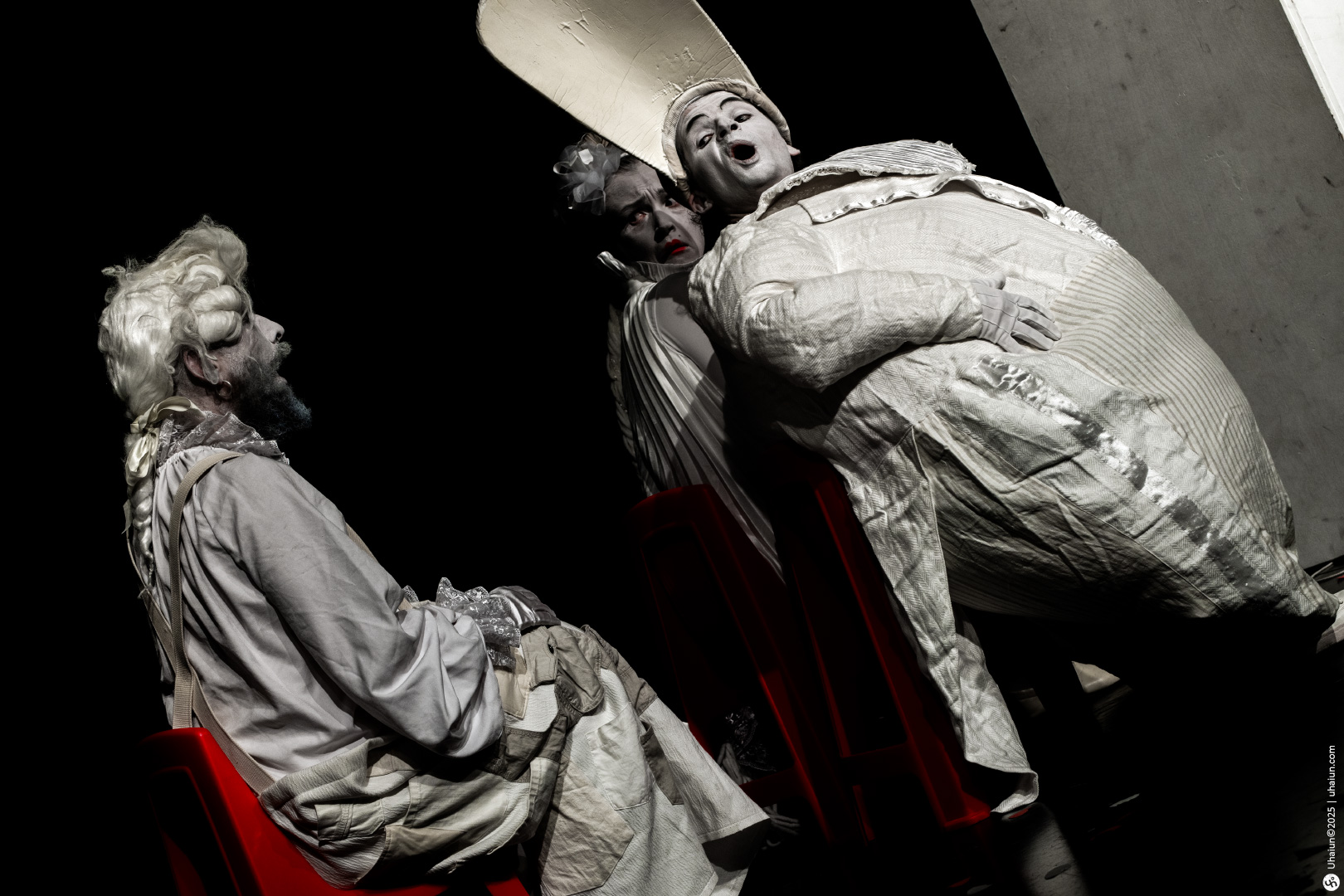 Monochrome theatrical performance with expressive actors