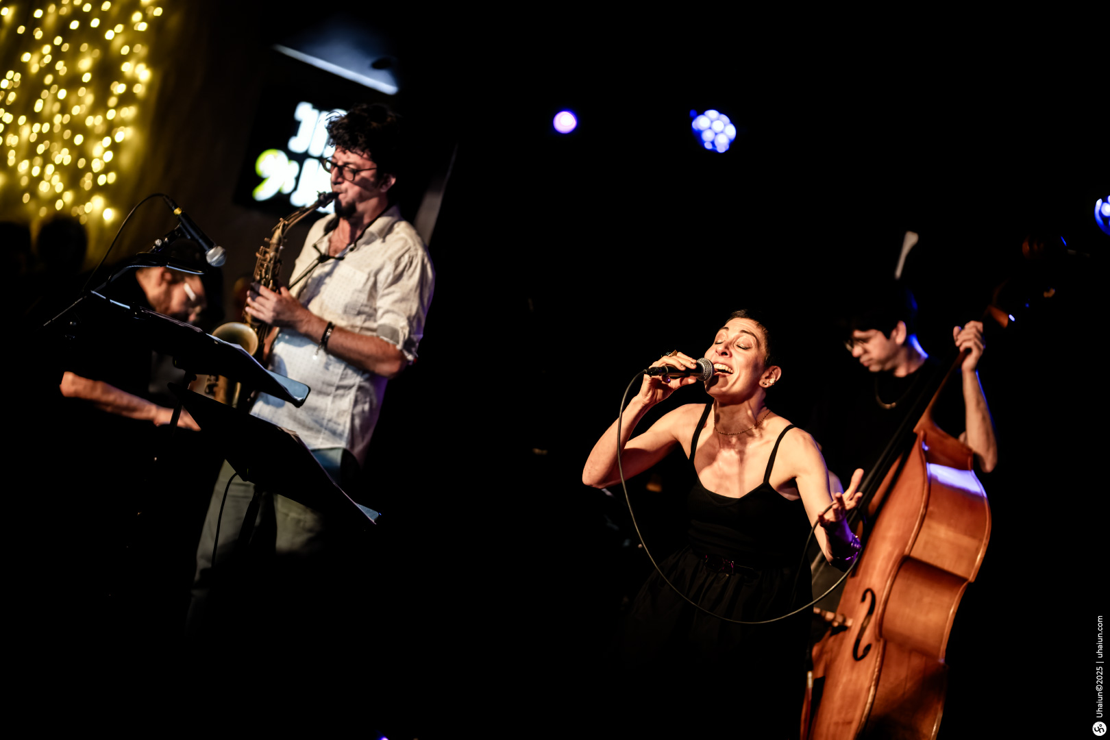 Live jazz band performing on indoor stage