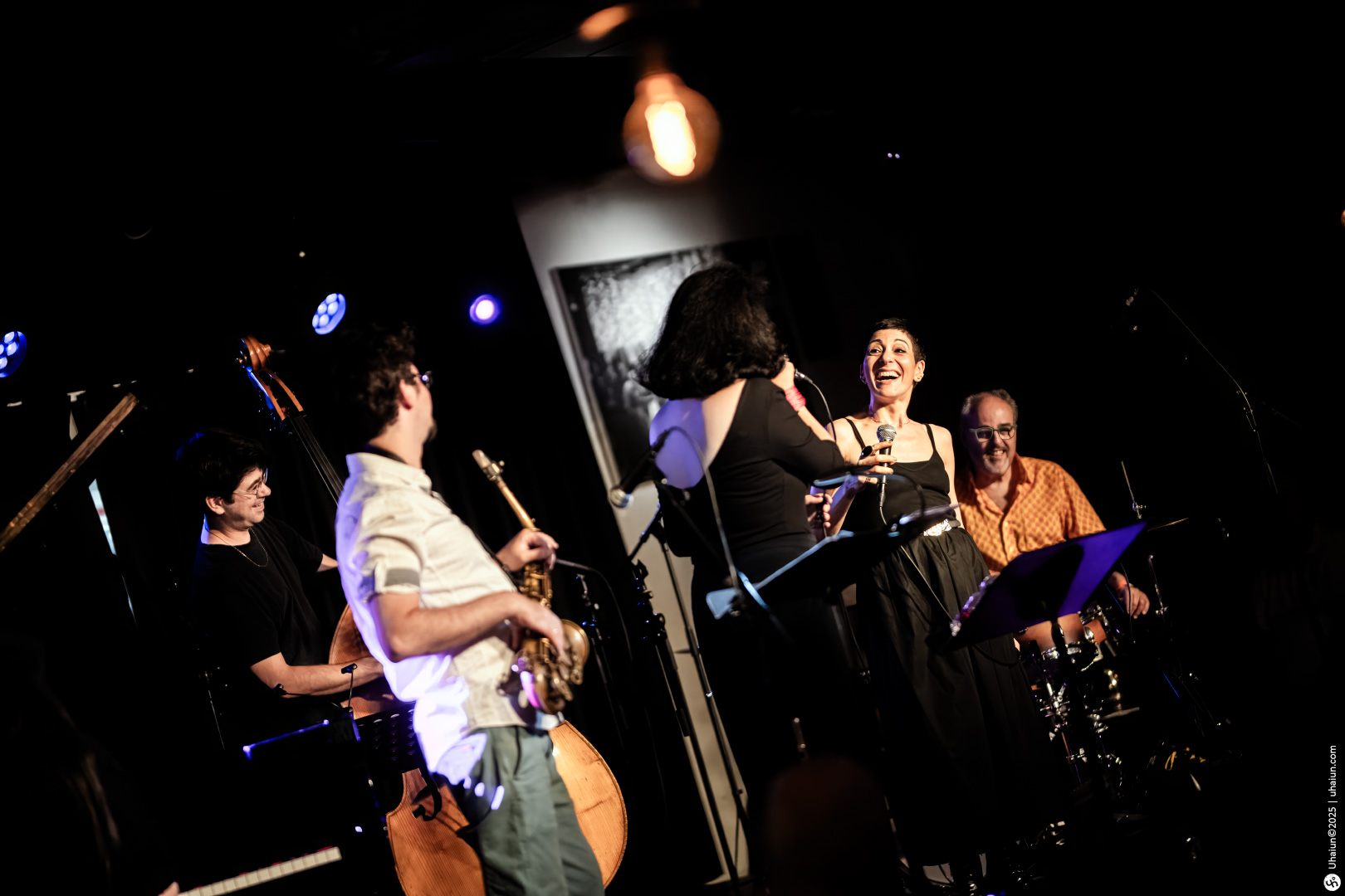 Live jazz band performing on stage energetically