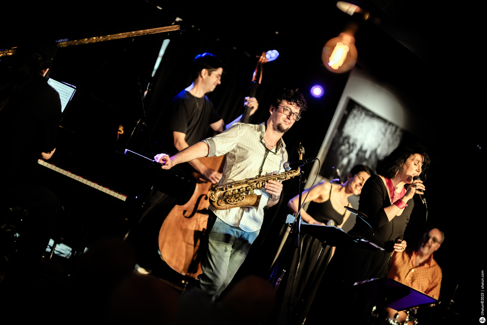Live jazz band performing on stage enthusiastically