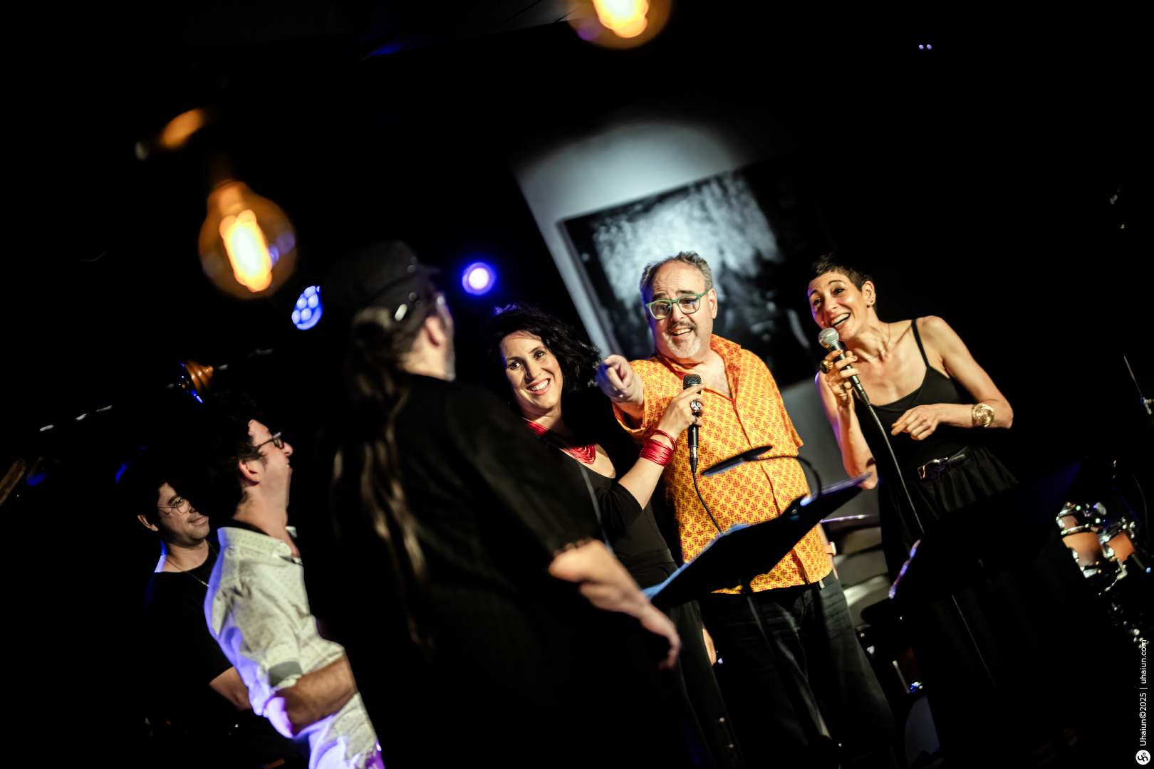 Group of musicians performing live on stage