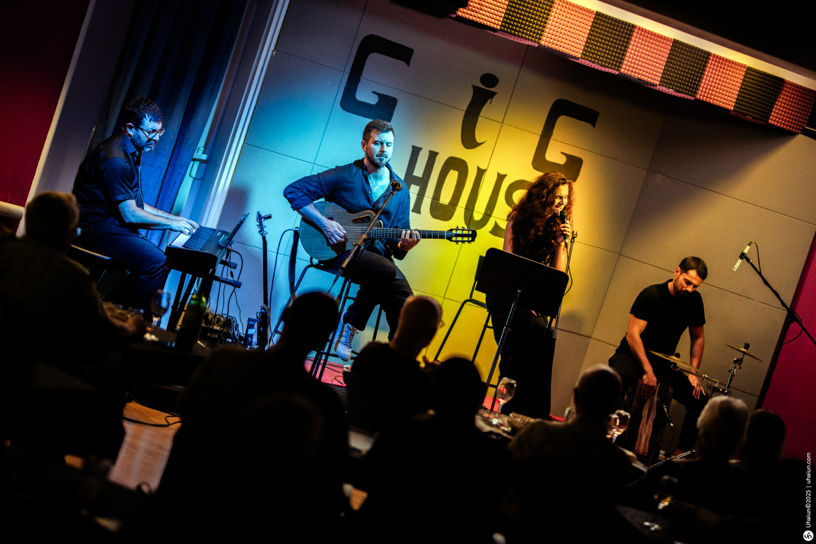 Live band performing on stage at Gig House