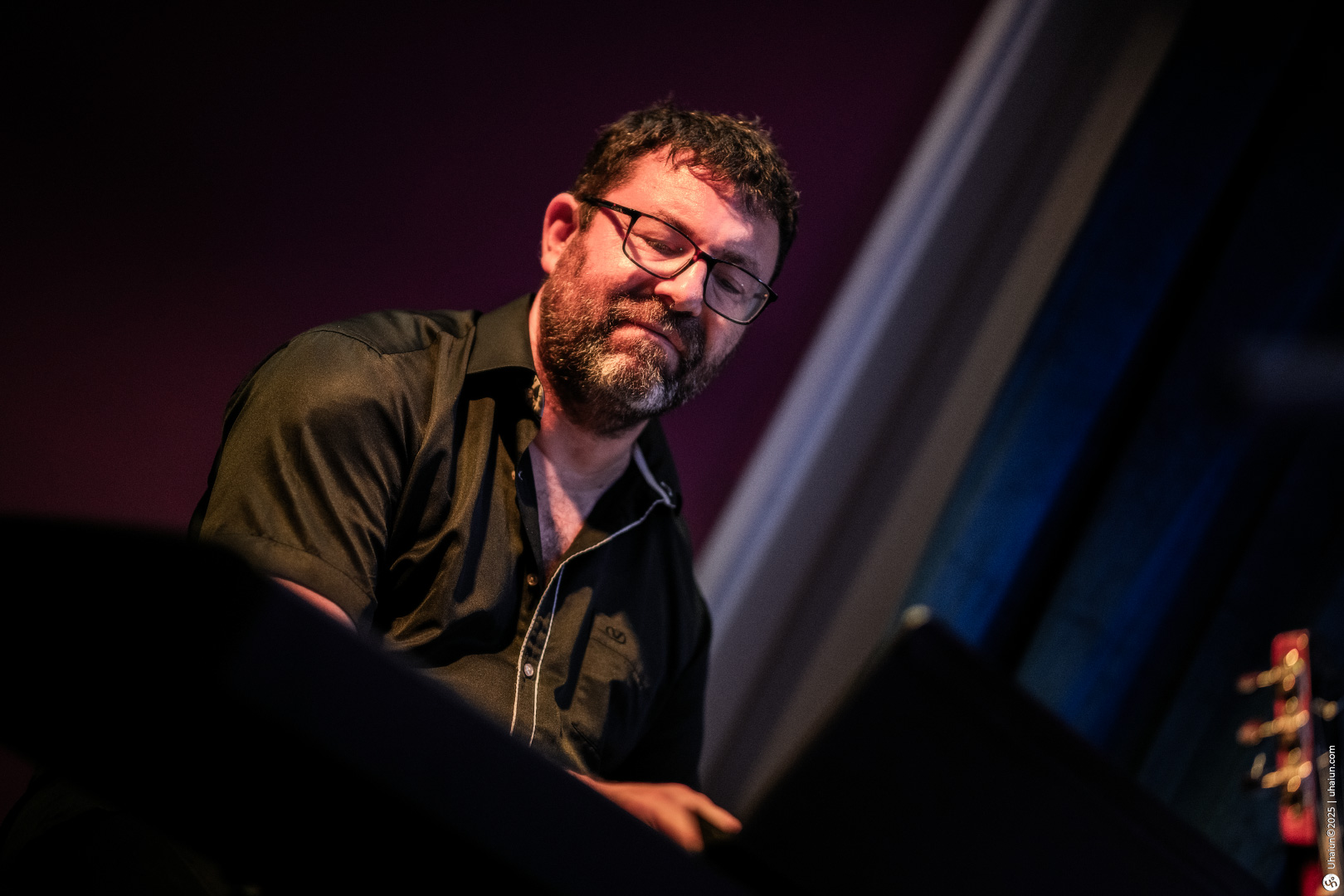 Man playing piano at a jazz performance
