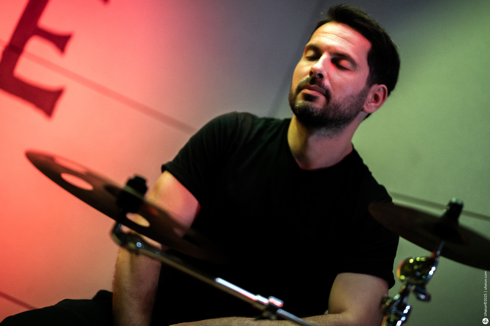 Man playing drums at a live performance
