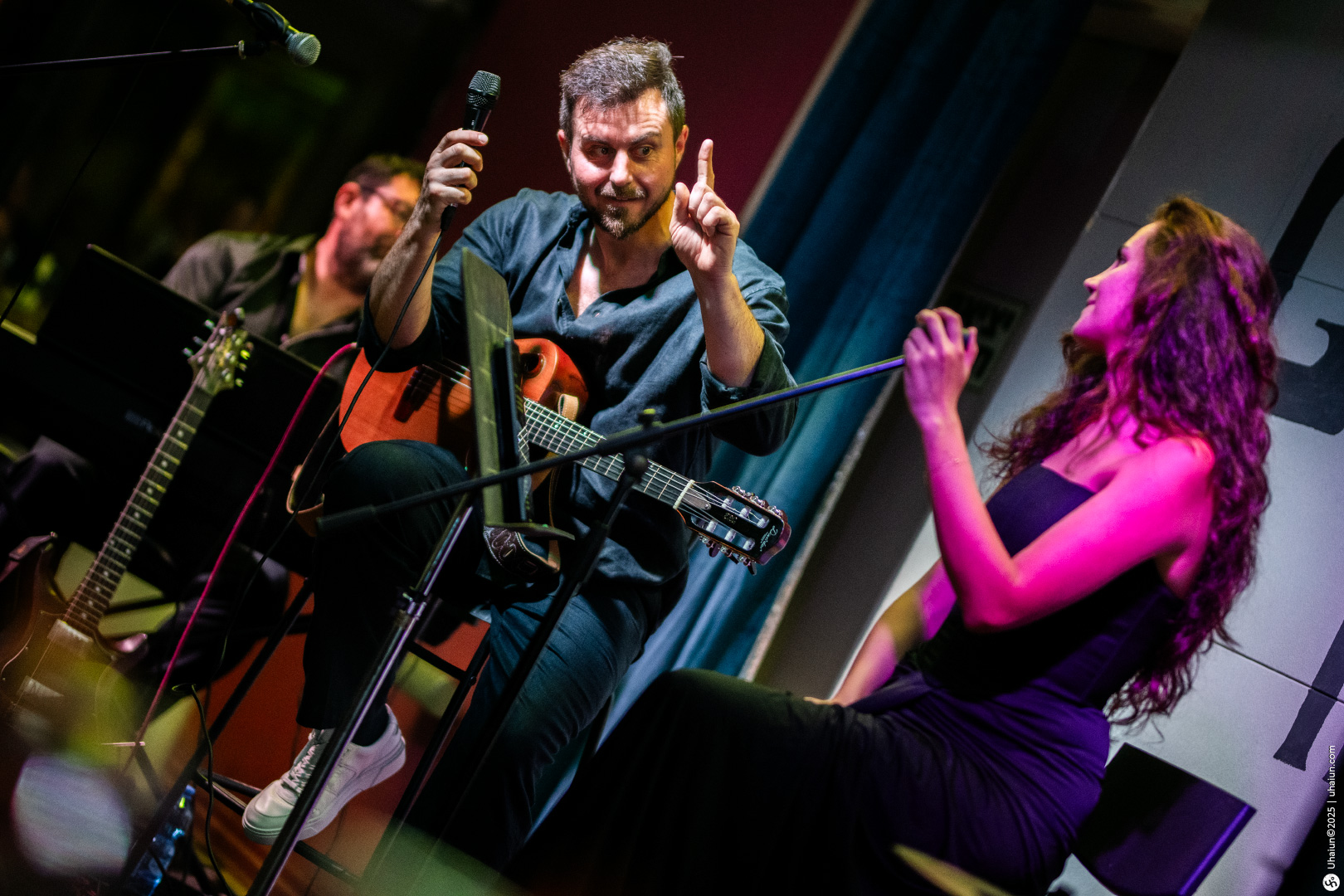 Musicians performing at a vibrant live concert