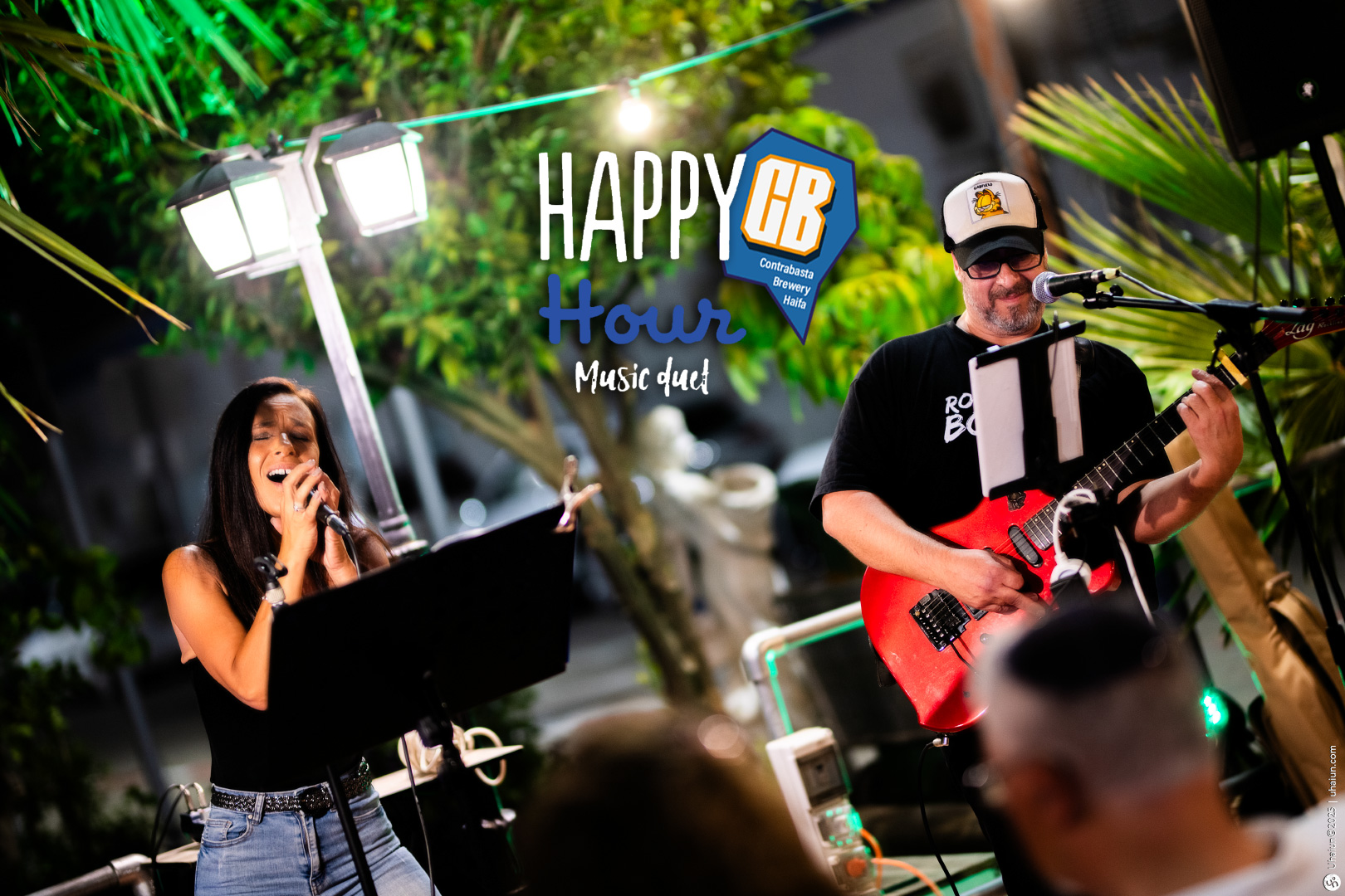 Live music performance at outdoor happy hour
