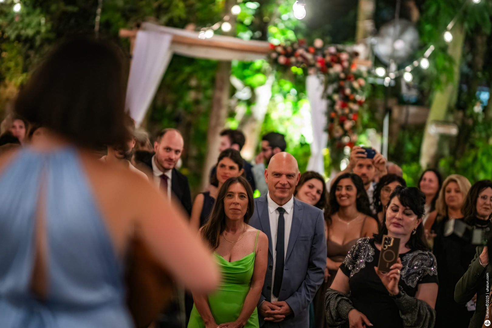 Guests enjoying a lively evening wedding celebration