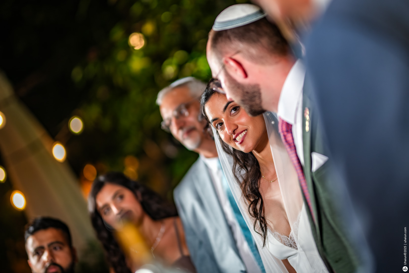 Wedding ceremony with smiling bride and guests