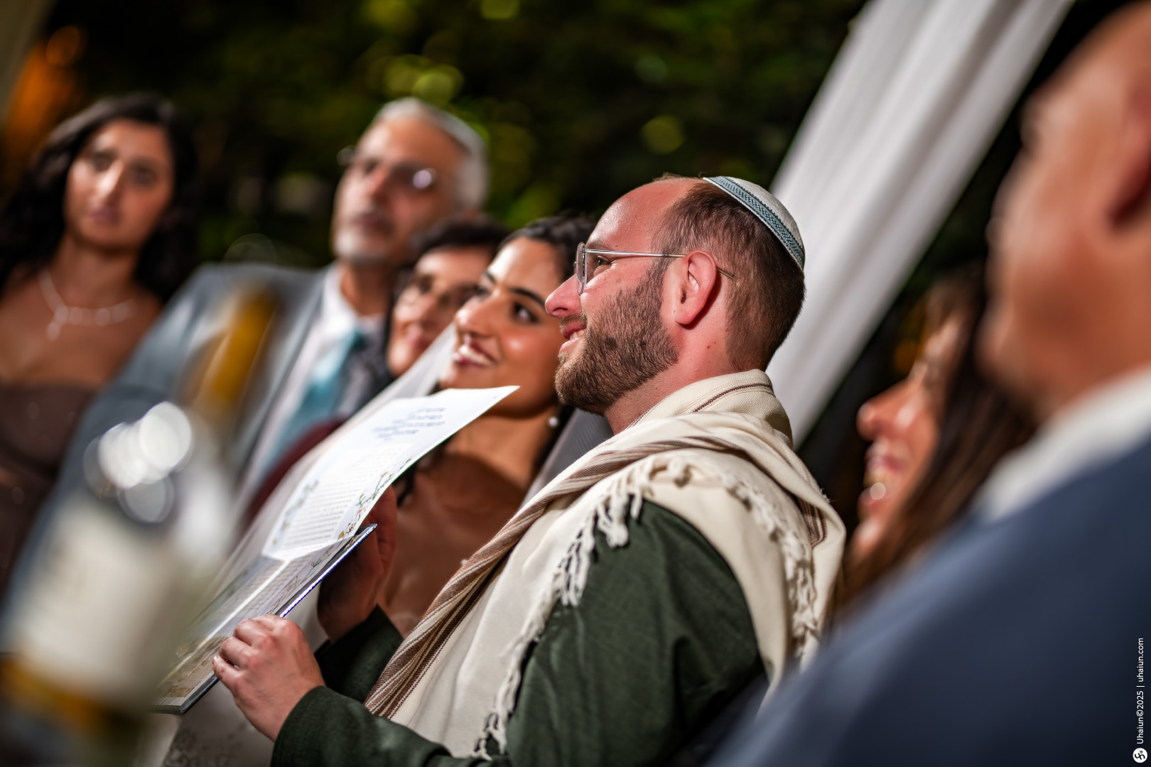 Group celebrating at a Jewish wedding ceremony