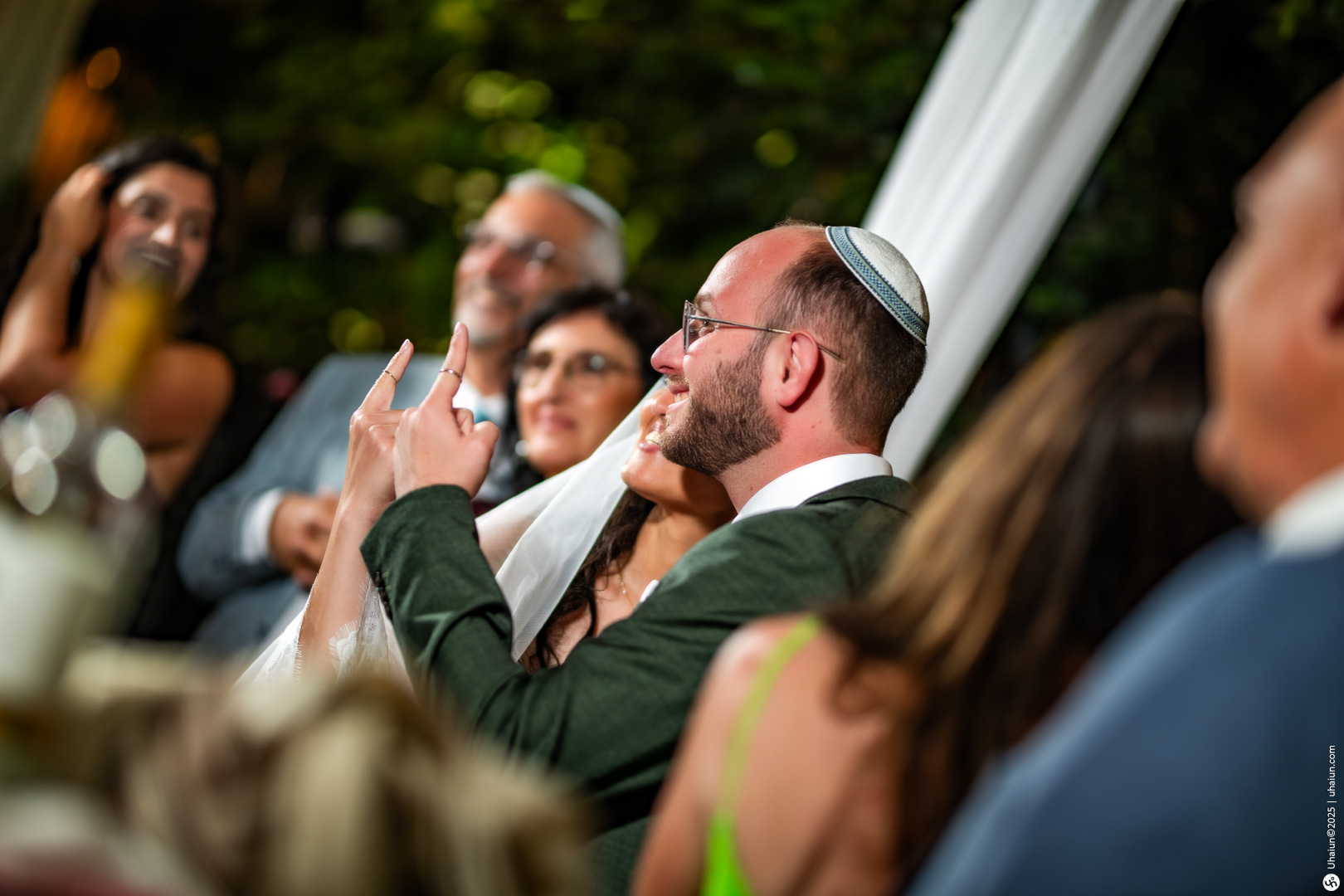 Guests celebrating at a joyful Jewish wedding ceremony