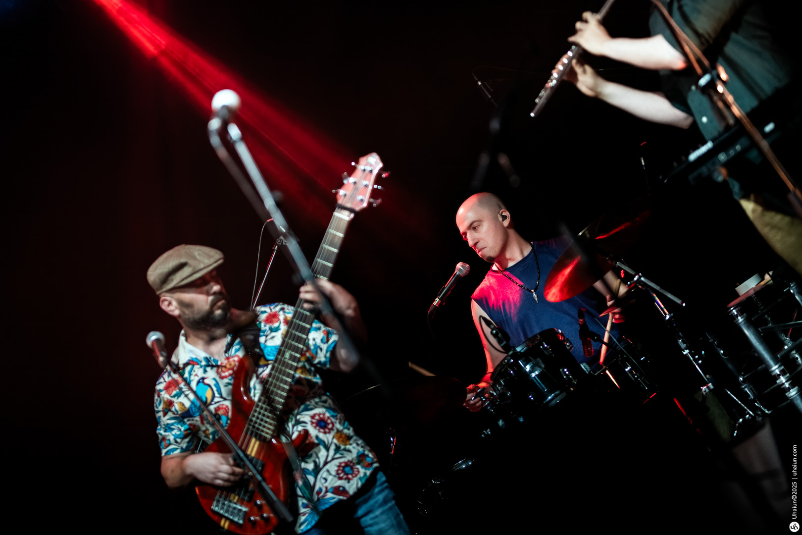 Band performing live music on stage together