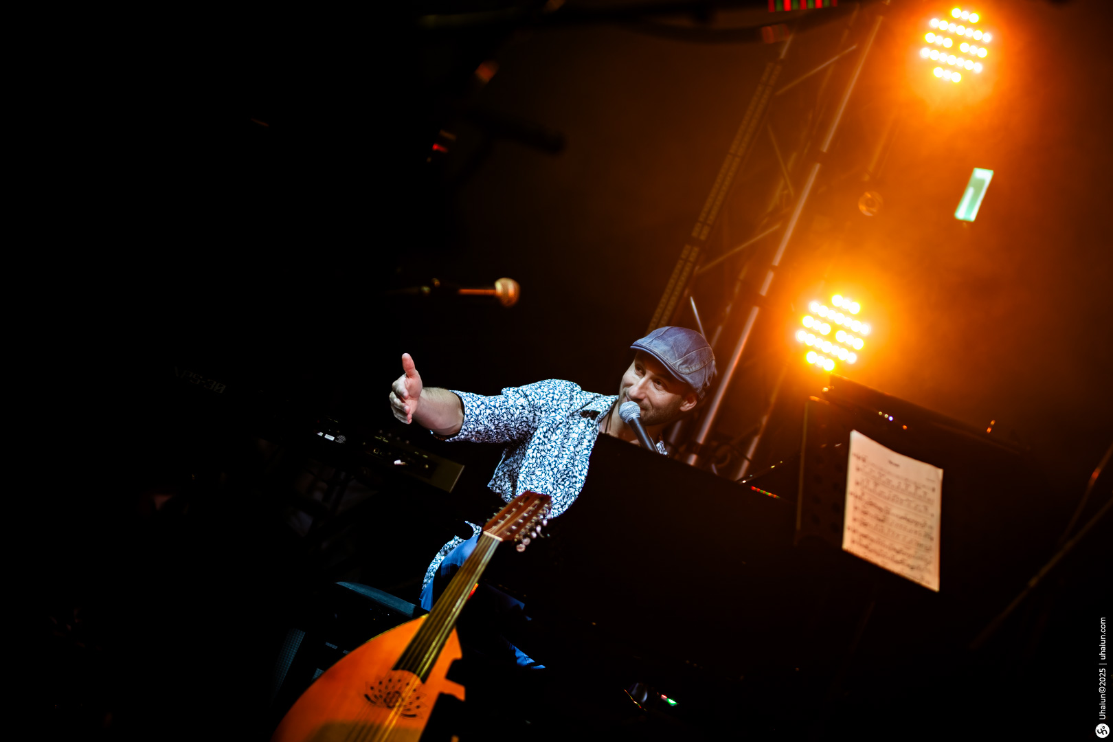 Musician performing on stage with bright lighting