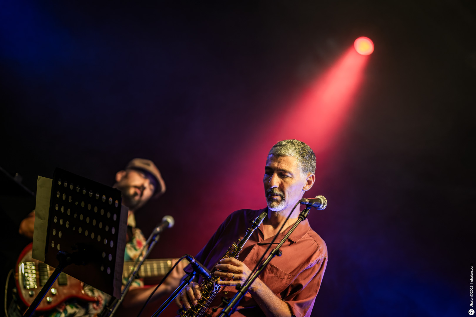 Jazz musicians performing on stage with trumpet
